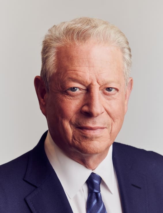 Former Vice President Al Gore wearing a navy suit